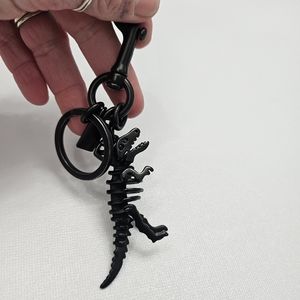 Coach rexy keychain